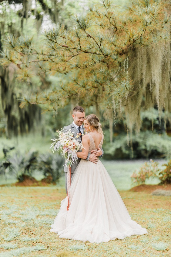 bride and groom for peach and gray spring wedding 2021