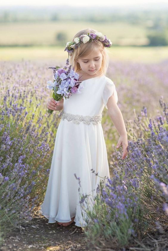 flower girl with lavender bouquets for lavender and gray summer wedding 2021