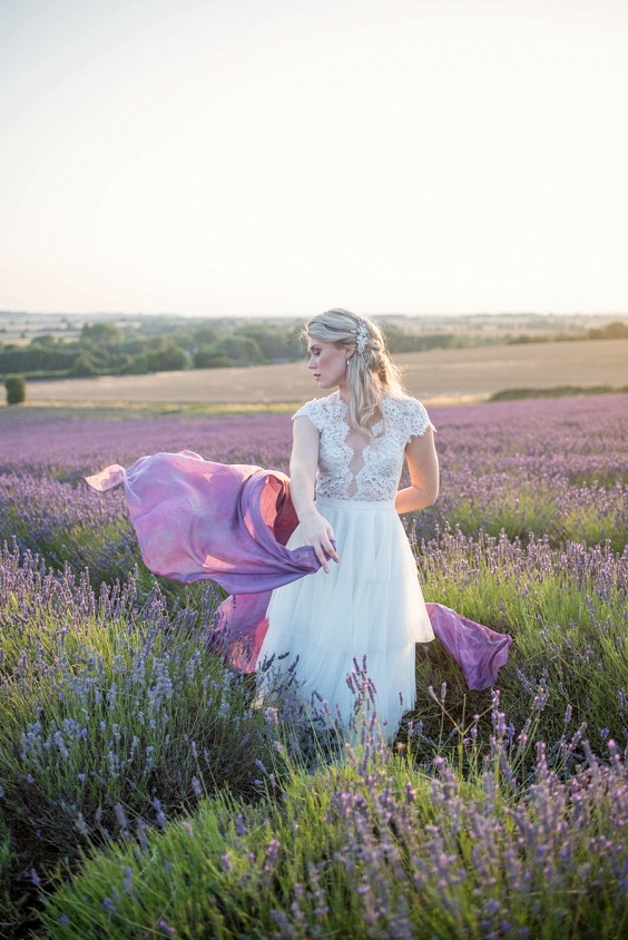 white bride in lavender land for lavender and gray summer wedding 2021