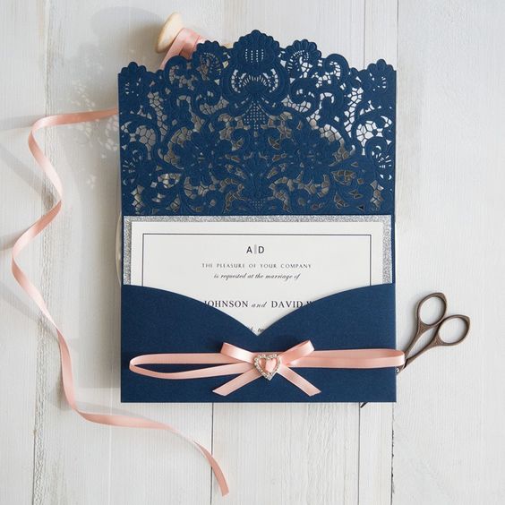 navy wedding invite with peach ribbon for navy and peach summer wedding 2021