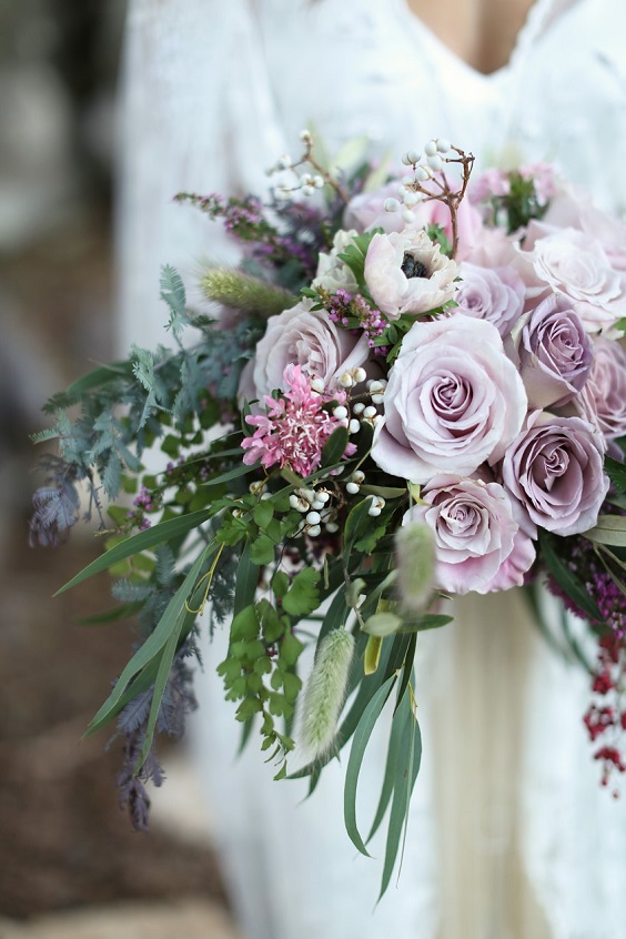 bride with bouquet for mauve and green summer wedding 2020