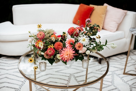 sofa table and flowers for red and orange summer wedding 2020