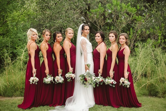 blush wedding dress with burgundy bridesmaids