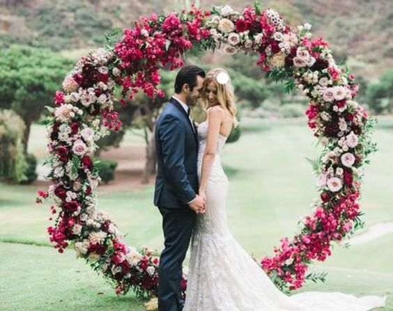 floral wedding decor arch for burgundy and pink winter wedding 2021