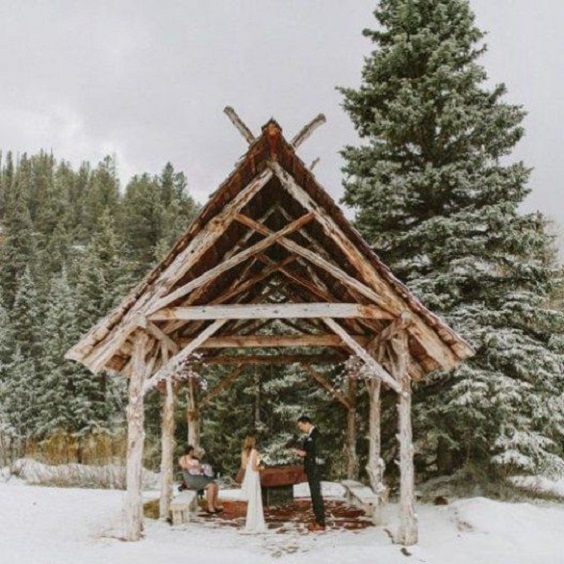 woodland wedding ceremony decor for gold and green winter wedding 2021