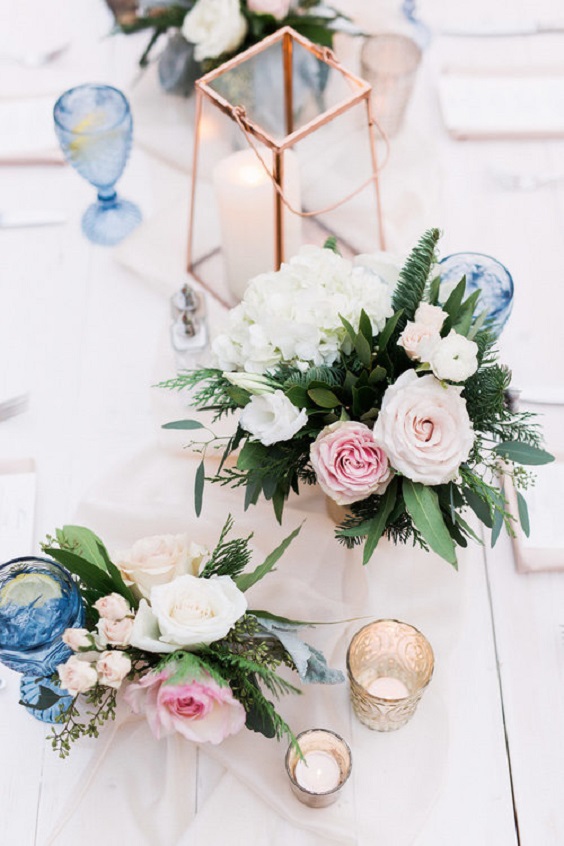 ice blue glass and flower centerpiece for ice blue and blush winter wedding 2021