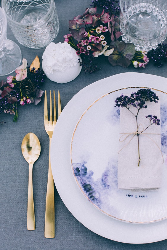 table setting and purple flower decorations for dusty blue and purple fall wedding 2020