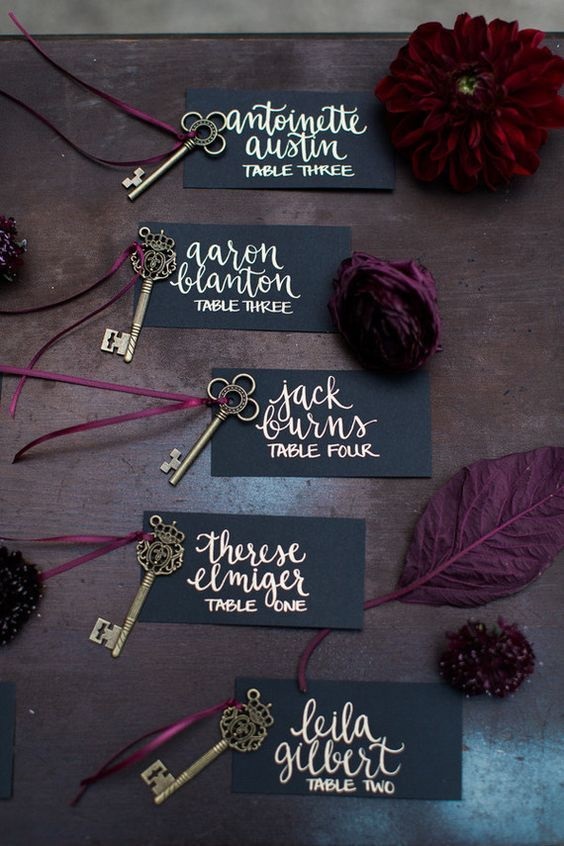 table card with gold calligraphy for black and burgundy fall wedding 2020