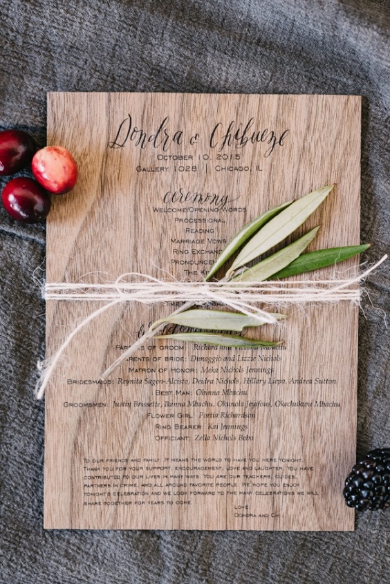 wedding program on stained wood for grey gold and burgundy fall wedding 2020