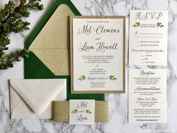 gold glitter wedding invitation with greenery for white and gold august wedding color 2020