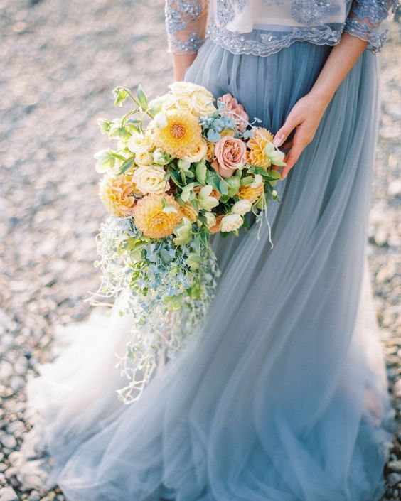 yellow wedding bouquet with greenery for yellow and dusty blue august wedding color 2020