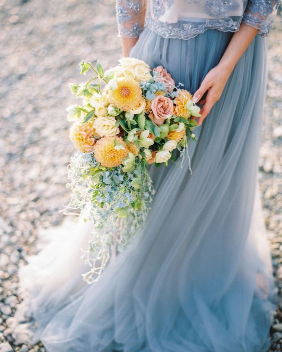 yellow wedding bouquet with greenery for yellow and dusty blue august wedding color 2020