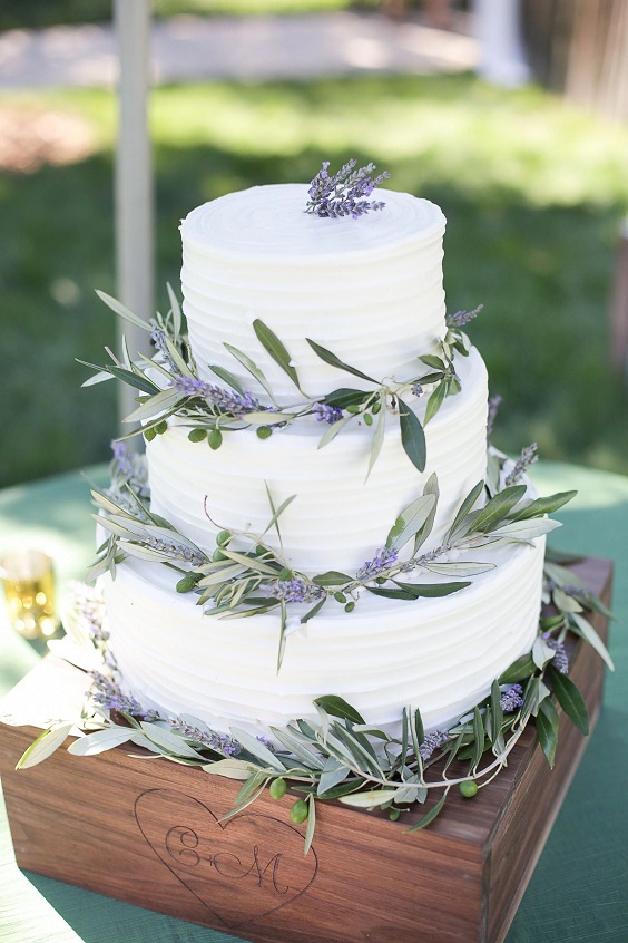 white wedding cake with greenery for lavender and green august wedding color 2020