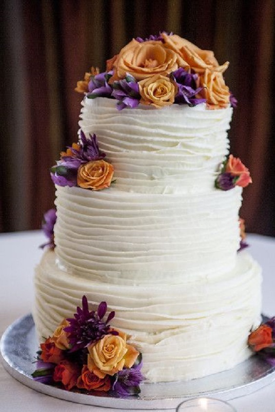 white wedding cake and cake topper for dark purple orange white october wedding colors 2020