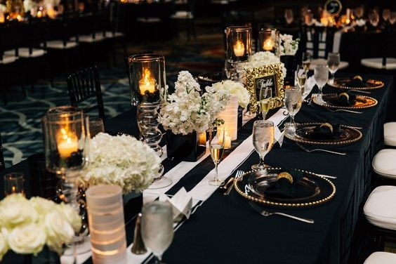 black wedding table setting and white centerpiece for black gold october wedding colors 2020
