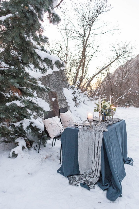 dusty blue tablecloth and silvery table runner for dusty blue and silver december wedding 2020