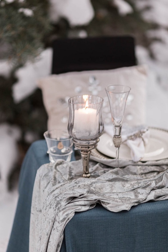 silver candleholders for dusty blue and silver december wedding 2020