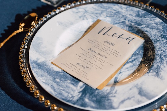 menu and gilded dinnerware for navy blue and gold december wedding 2020