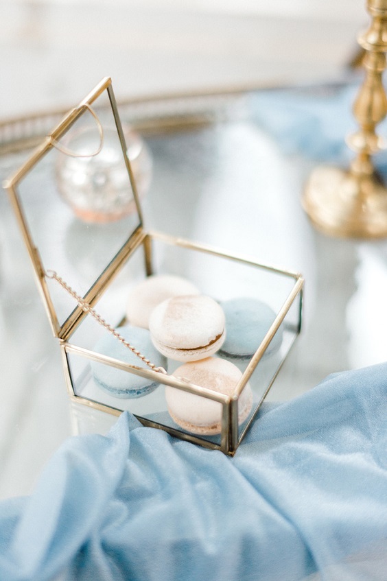 gilded galss box filled with macaroons for ice blue white and gold december wedding 2020