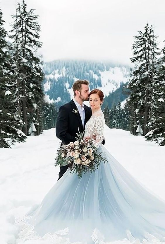 ice blue bridal gown and black mens suit for ice blue white and gold december wedding 2020