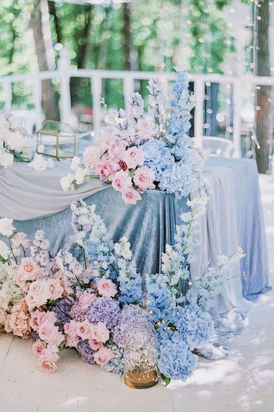 blush and light blue table setting with flowers for blush and light blue march wedding color 2021