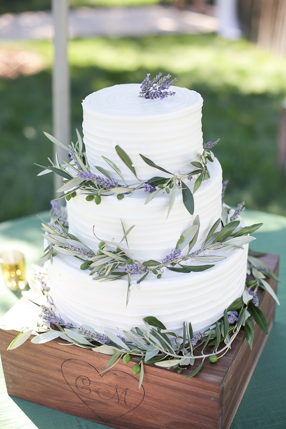 white wedding cake with greenery for lavender and sage green march wedding color 2021