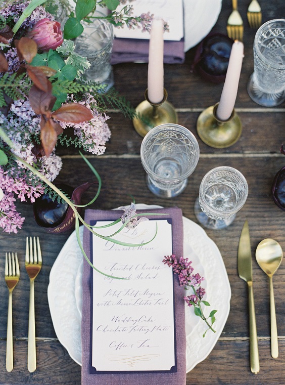 wedding table setting with plum menus for plum and grey march wedding color 2021