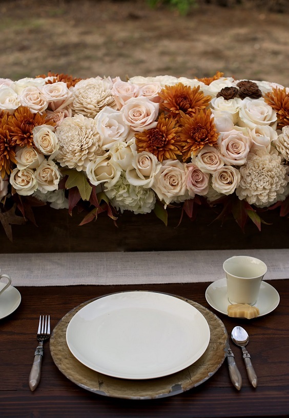 wedding table decorations and dusty orange flowers for dusty orange and grey september wedding color 2020