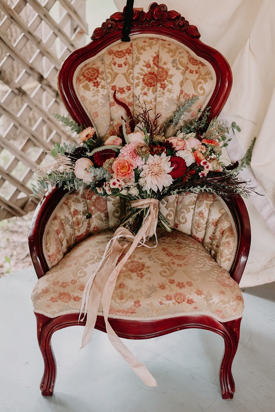 wooden chair for green and maroon rustic fall wedding