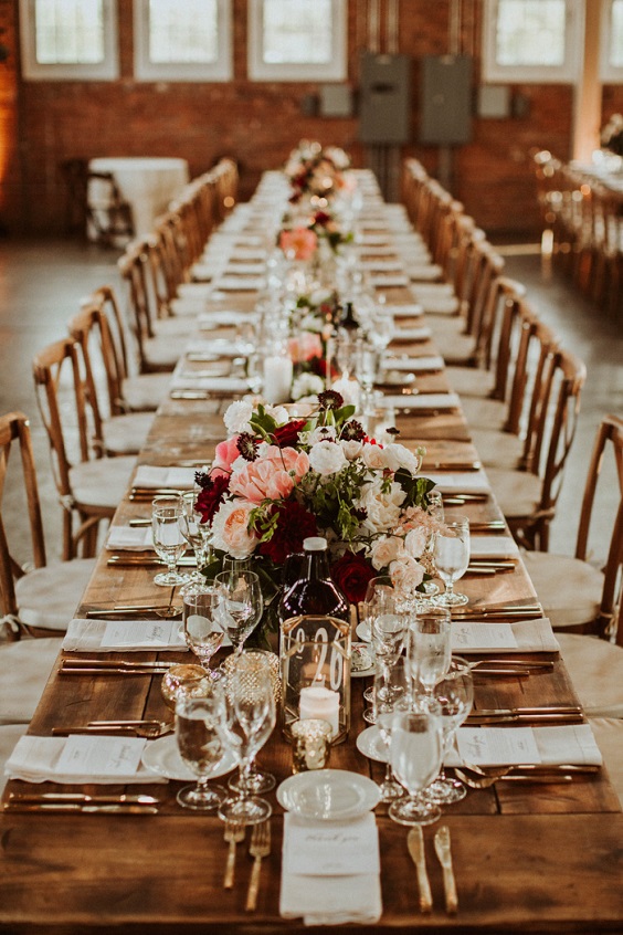 wooden long table for burgundy and orange rustic fall wedding
