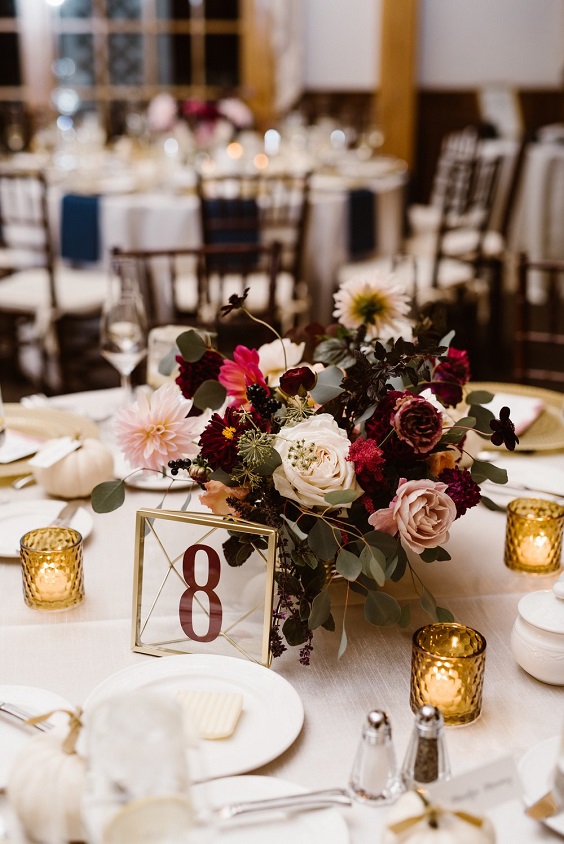 table number candles and centerpiece for burgundy fall wedding colors burgundy and blush