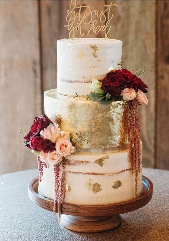 white and gold wedding cake with burgundy flowers for burgundy fall wedding colors burgundy and gold