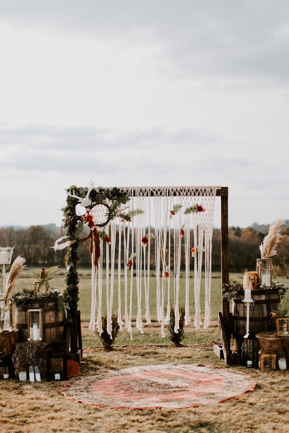 arch with white tassel and greenery decorations for burgundy fall wedding colors burgundy and dusty rose