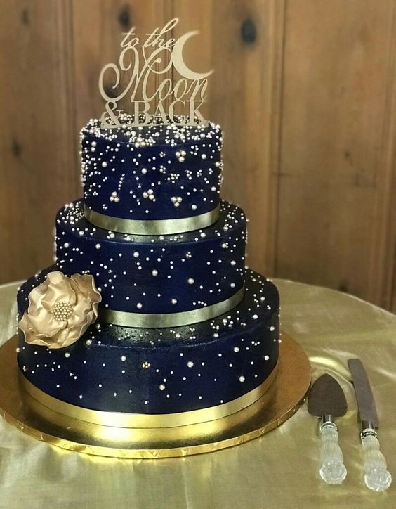 navy blue wedding cake with gold cake topper and cake standfor navy burgundy gold wedding colors