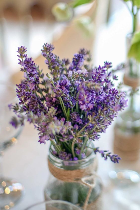 mason jar centerpieces with lavender flowers for navy lavender fall wedding colors