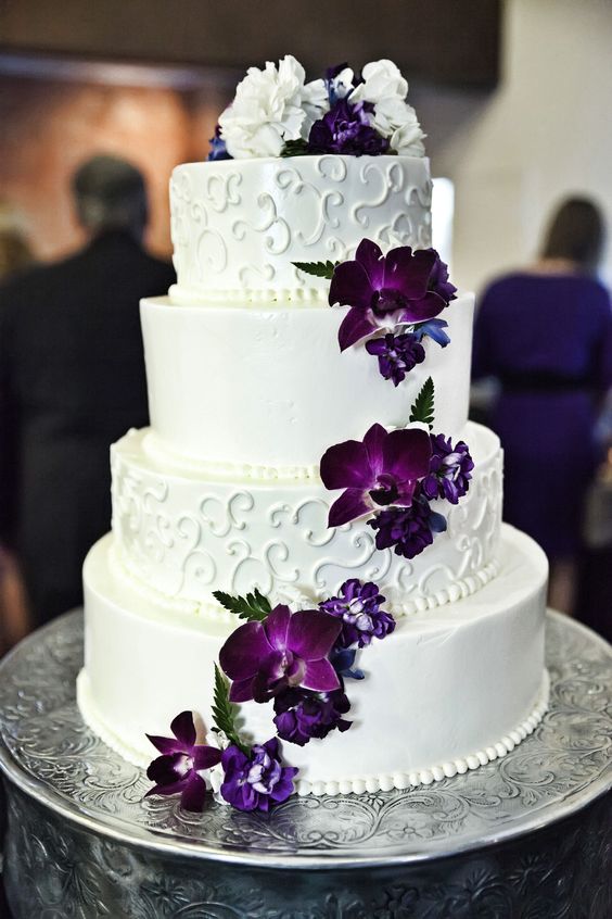 white wedding cake with purple flowers for purple and white purple fall wedding colors