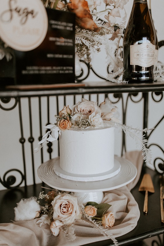 white wedding cake with blush florals for neutral fall wedding colors taupe white and grey