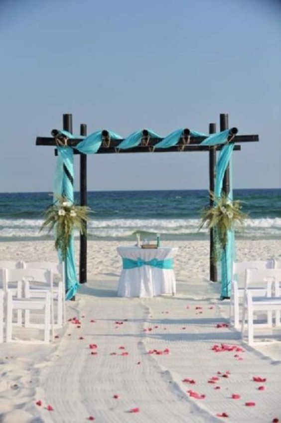 turquoise ceremony arch for turquoise orange beach wedding colors 2020