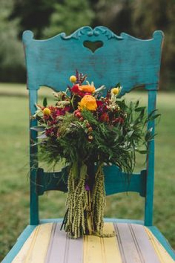 teal chairs and red bouquets for teal red teal fall wedding colors