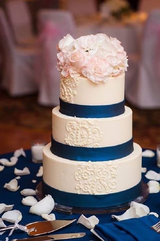 white wedding cake with navy blue ribbon for elegant rose gold and navy blue wedding