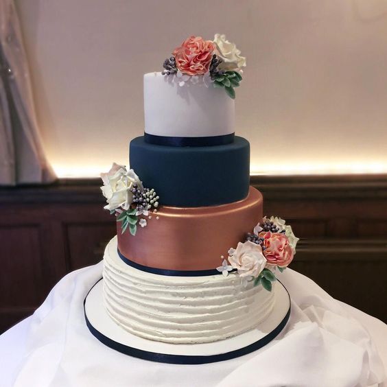 rose gold and navy blue wedding cake with flowers for rustic rose gold and navy blue wedding
