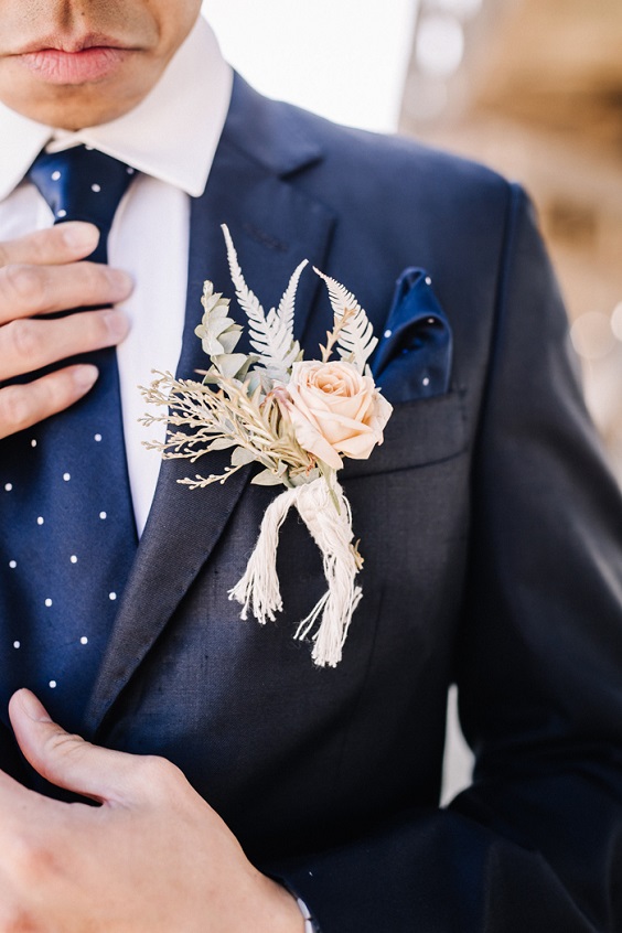 navy blue grooms attire and blush boutonniere for navy blue blush boho beach wedding