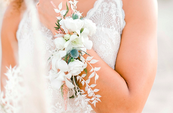 white and teal wrist flower for white teal boho beach wedding