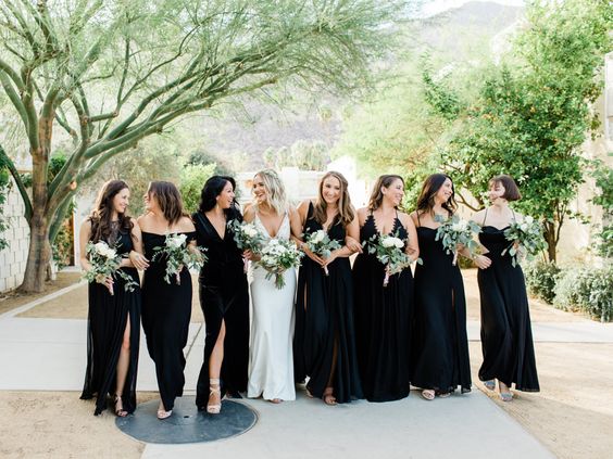 white bridal gown black bridesmaid dresses with white bouquet and greenery for black wihte green wedding color
