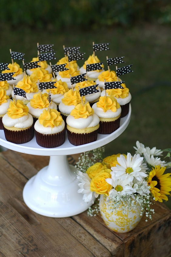 white yellow wedding cupcake with black white flag decoration for black white yellow wedding color