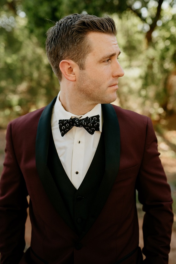 groom burgundy suit with black neckline and bowtie for black white burgundy wedding color
