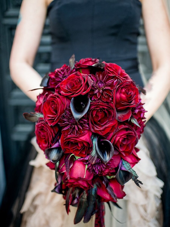 black bridal gown and red bouquet for red and black wedding colors red black and purple