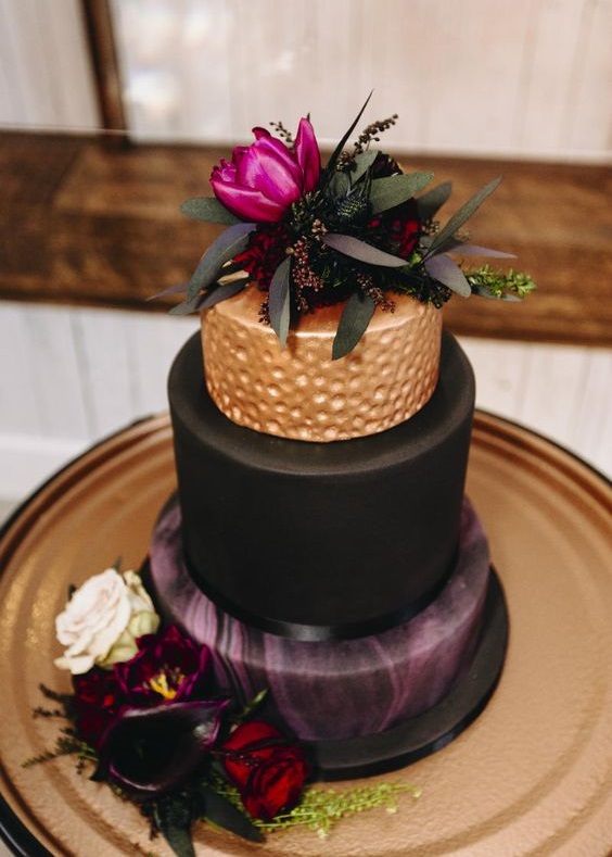 black gold and purple wedding cake with red flowers for red and black wedding colors red black and purple