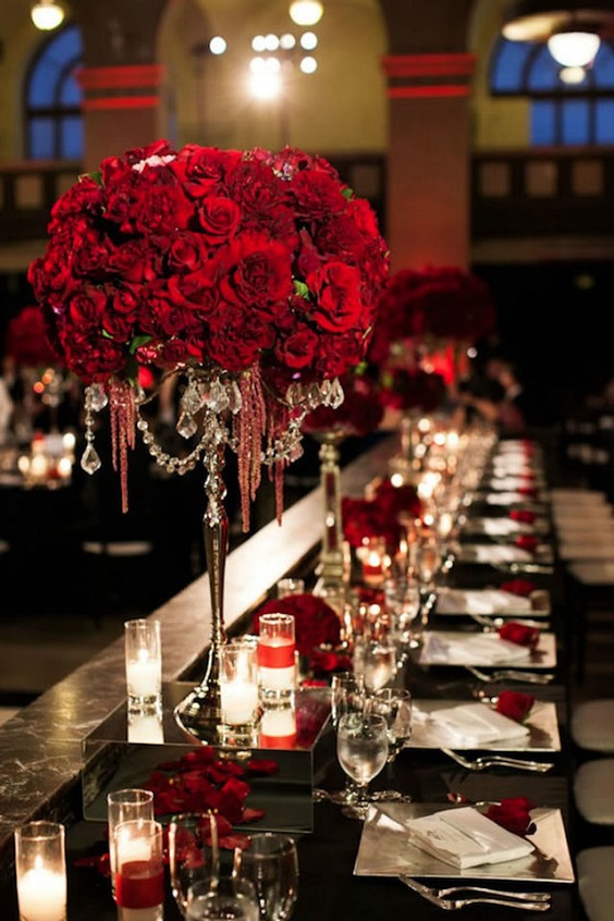 red centerpiece and black tablecloth for red and black wedding colors red black and silver