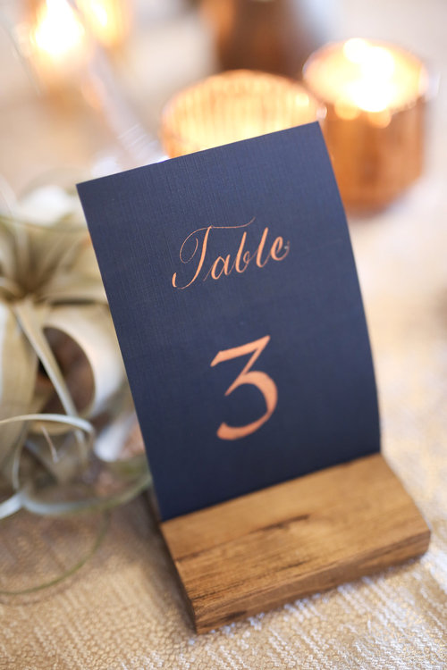 navy blue and gold table number for navy gold and rust wedding color combo